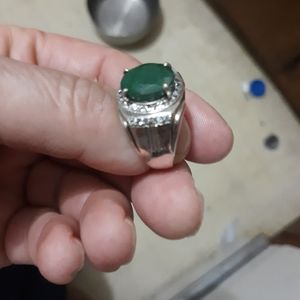 A Brazil South America Emerald with white sapphire